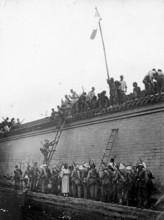 Boxer Rebellion, China, protests on a wall during the Boxer War. Chinese people gather on a wall