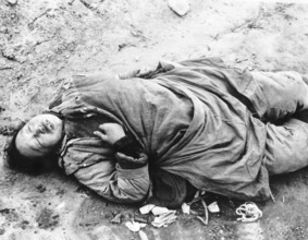 Chinese woman in Brenan Road, Shanghai. Shot for looting. The Second Sino-Japanese War began on 7