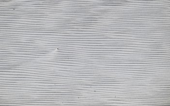 Close-up of a sandy area with fine, wavy lines in shades of grey, near Hvide Sande, North Sea,