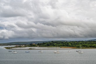 Yachts over Ramshorn Lake and Brownsea, Poole, Dorset, England, United Kingdom