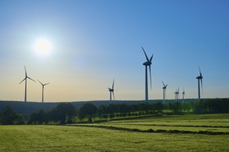 Wind turbines adorn a landscape with sunny skies and green fields, summer, Rohren, Monschau, Eifel,