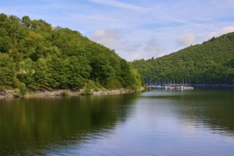 Quiet lake with boats and wooded hills in the background, summer, Rursee, Rurberg, Simmerath, Eifel