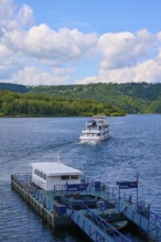 A passenger ship moves away from the landing stage, on a large lake, summer, Rursee, Rurtalsperre,