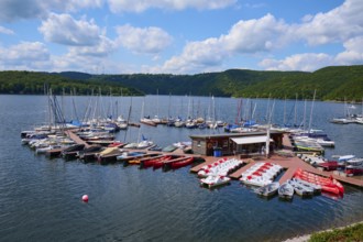Boats gather at a large jetty, under a cloudy sky, summer, Rursee, Rurtalsperre, Heimbach,