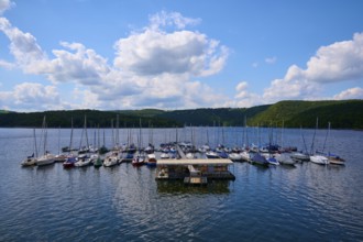 Sailing boats at a jetty, with partly cloudy sky, summer, Rursee, Rurtalsperre, Heimbach,
