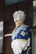 Interior of historic The Sailors Reading Room, Southwold, Suffolk, England, UK - figurehead of King