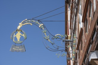 Nose sign, inn sign, blacksmith's art on a house wall in the historic centre of Esslingen,