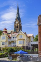 Church (Lysekils kyrka) and section of the house front at the south harbour, Lysekil, BohuslÃ¤n,