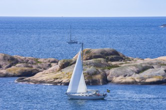 Archipelago with sailing boats off the coast of Lysekil, BohuslÃ¤n, VÃ¤stra Götalands lÃ¤n, Sweden,