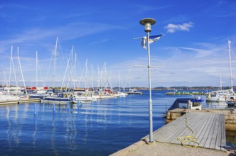 Picturesque scenery of sailing boats in the marina on the waterfront in the harbour of Lysekil,