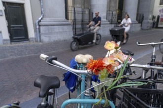 Cycling in the Netherlands, Utrecht, parked bike with flower decoration on the handlebars