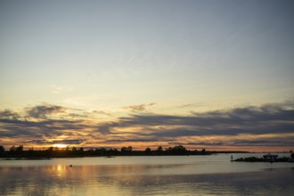 Idyllic view of the Gulf of Bothnia in the Kvarken Archipelago at sunset with calm water and
