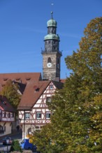 St. John's Church tower, historic half-timbered house in front, Lauf an der Pegnitz, Middle