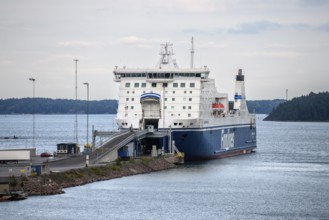 Large ferry on the Finnlines line Naantali Kappelskär in Naantali harbour over calm water,