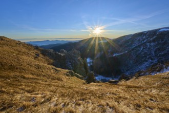 Intense sunshine over an extensive mountain range, clear and cool atmosphere, view of the Rhine