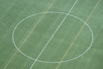 Bird's-eye view of soccer grass field with central circle, view from the tower of the Olympic