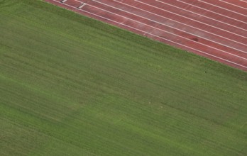 View of well-maintained stadium lawn and tartan track from the Olympic Stadium tower, Helsinki,