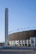 Tower with external staircase, Olympic Stadium with flags on the roof, architects Yrjö Lindegren