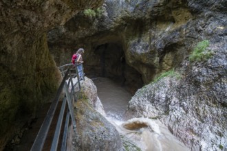 Woman hiking in the Almbach Gorge, Berchtesgaden Biosphere Reserve, Almbach, Berchtesgaden Alps,
