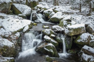 Ilse Falls with snow and moss covered rocks in winter, Heinrich-Heine-Weg, Ilsetal, Harz National