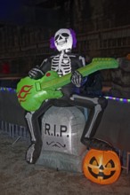 Death plays guitar, illuminated scary figure at Halloween Run, Landschaftspark Duisburg-Nord,