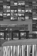 The lights of the Imhoff Chocolate Museum, behind them the illuminated façade of Kranhaus Nord,