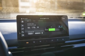 Electronic vehicle instrument shows fast charging information in modern interior, MG4 electric car,