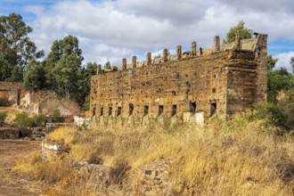 Ruins of former ore dock, Mina de Sao Domingos, historic copper open-pit mine, aerial view,