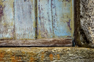 Colors and textures of an old wooden window weathered by time, in the city of Ouro Preto, Ouro