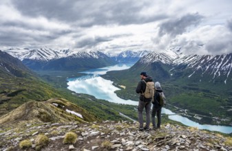 Two mountaineers in front of mountain scenery, Slaughter Ridge Trail, view of snow-covered