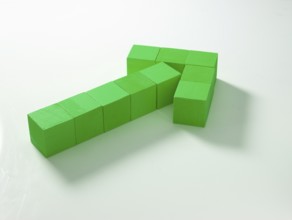 10 green wooden cubes against a white background