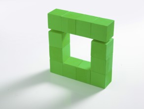 12 green wooden cubes against a white background