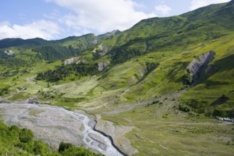 Scrambled landscape with green slopes and small rivers, landscape between Kvesheti and Gudauri,