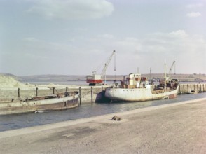 China clay industry, Ashmead cranes and cargo ship on harbour at Par, Cornwall, England, UK 1960s