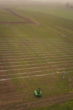 Prepared fields for solar plant construction, green environment, machine operation for