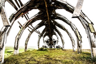Interior view of an impressive outdoor wooden structure, sculpture by Drakkar Vardø. The