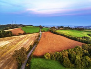 Sunset of Devon Farms and Fields over Berry Pomeroy from a drone, Totnes, England, United Kingdom