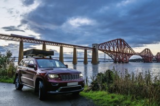 4x4 car trip with roof tent in Forth Bridge, Queensferry Crossing, Forth Estuary, Scotland, United