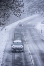 Country road in Elfringhauser Switzerland, near Sprockhövel, cars with and without headlights,