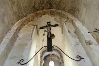 Maerier village. Low angle shows the architecture and crucifix hanging within the St Saturninus