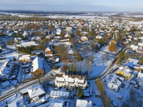 Snowy town view with many houses, a church and snow-covered roads, aerial view, Trinity church,