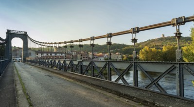 Suspension bridge of Coudes village on river Allier. Puy de Dome. Auvergne Rhone Alpes. France