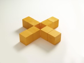 8 yellow wooden cubes against a white background