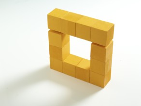 12 yellow wooden cubes against a white background