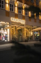 Illuminated shop windows of a clothing store with festive decoration, Nagold, Calw district, Black