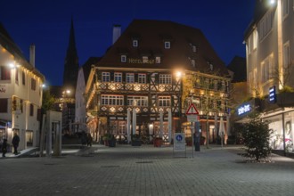 Night view of a traditionally designed half-timbered hotel in the city center, Nagold, Calw