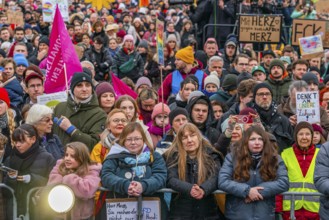 Participants with flags and posters at the demonstration against the right and for the preservation
