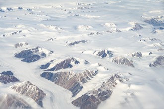 Snowy mountain landscape with glaciers, aerial view, Greenland, Arctic