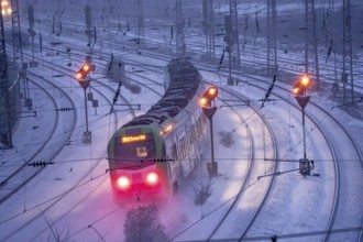 Winter weather, snowfall, regional train train, regional traffic, on the route east, in front of