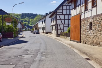 Residential and commercial buildings, historic half-timbered houses with sandstone base, entrance,